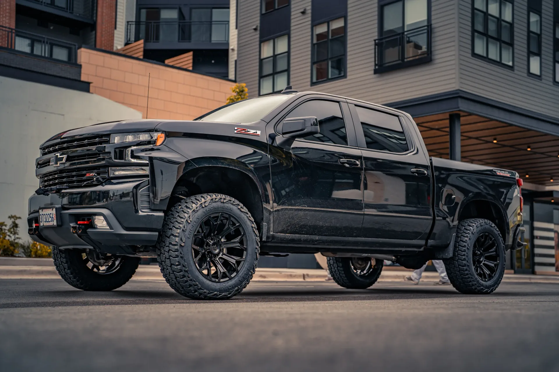 A lifted black Chevrolet Silverado Trail Boss built by Ernie's Custom Shop in Vernon Hills, IL